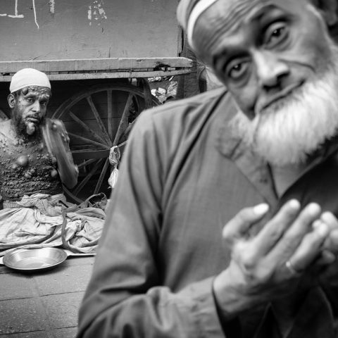 A leprous man and a beggar. Nizamuddin West, Delhi, 2018.