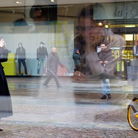 Take a photo of girl in window’s reflection