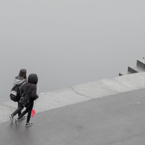 Walking by the river on the rainy day