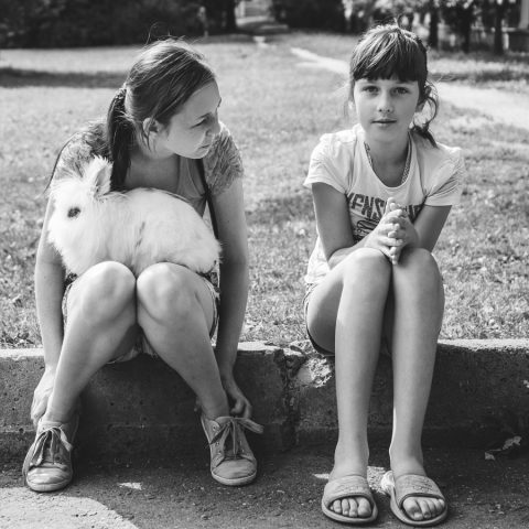 Two girls with a rabbit