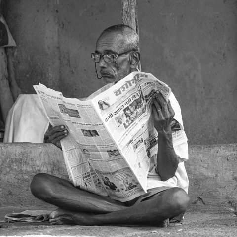 Reading newspaper