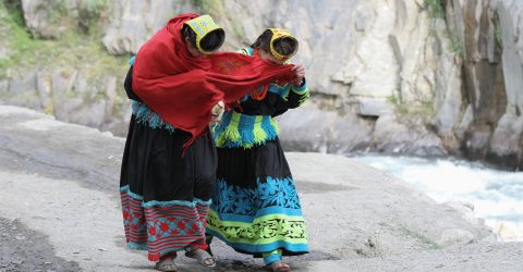 Shy Kalash girls hiding from the camera