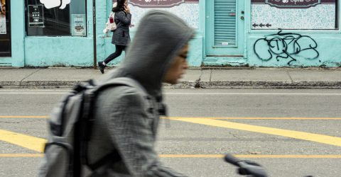 Cyclist and a girl in the background