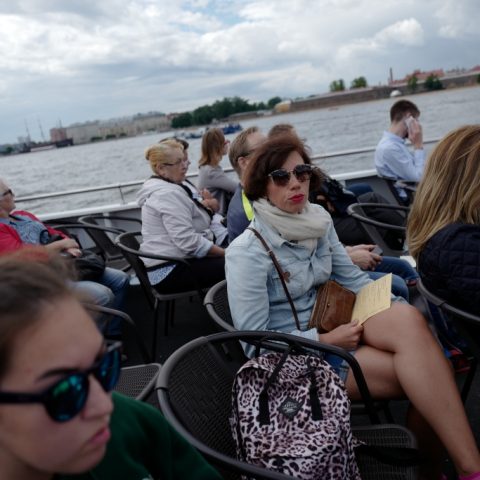 Tourists. Neva River Cruise.