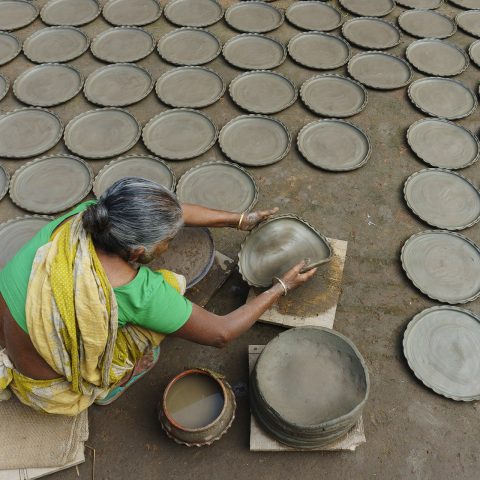 Wold woman and clay plate