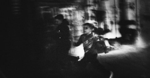 Local children running through the streets, Naples