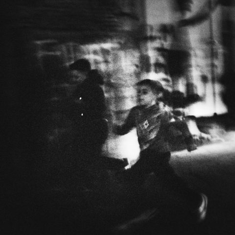 Local children running through the streets, Naples