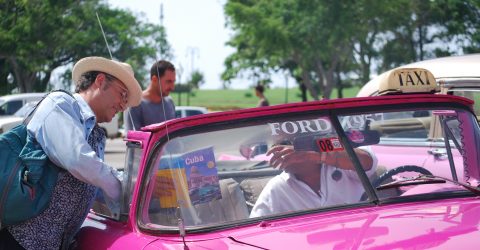 havana street – a taxi driver and a turist