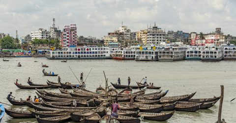Aerial view of traditional boats docked at Old Dhaka river port along Buriganga shoreline river in Dhaka, Bangladesh.