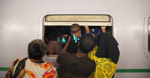Passengers riding trains through the window for challenging journey-02