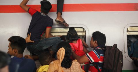 Passengers riding trains through the window for challenging journey-05