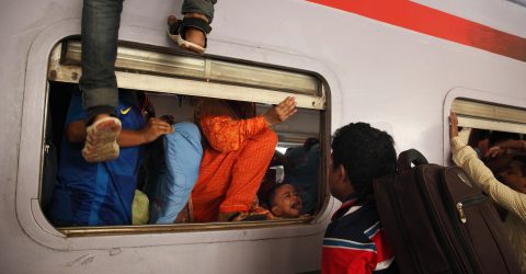 Passengers riding trains through the window for challenging journey-09