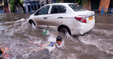 SWIMMING IN WATERLOGGED STREET