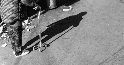 a woman with walking stick